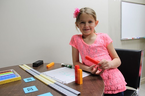 A photo of a young student learning Math at Foundations for Learning